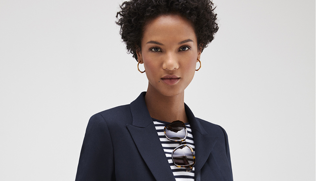 The key to relaxed style from Hobbs includes a navy blue blazerm striped tee shirts and sunglasses. 