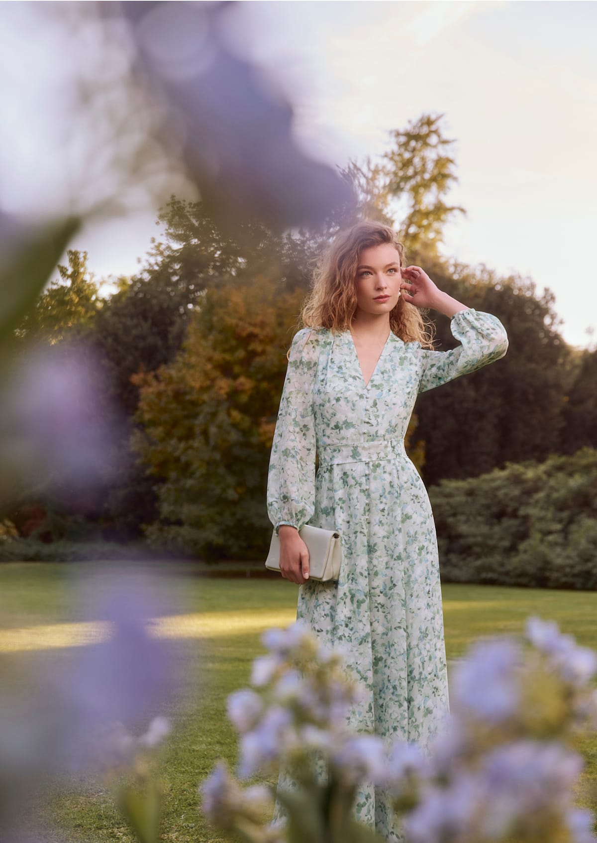 An image of a model wearing a Hobbs pink occasion dress.