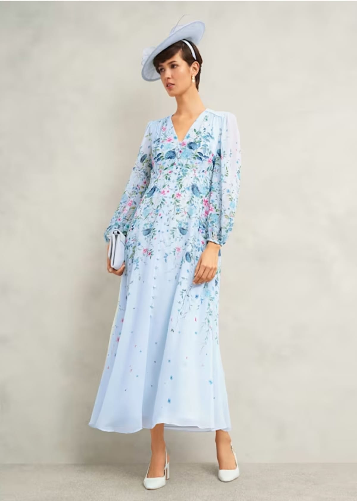 A gallery of four images of models wearing occasion floral midi dresses and coordinating accessories.