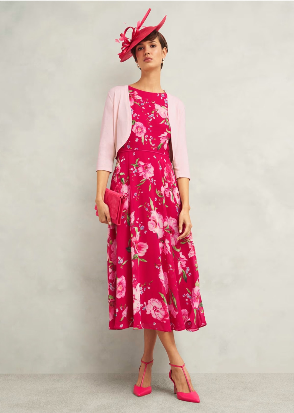 A gallery of four images of models wearing occasion floral midi dresses and coordinating accessories.