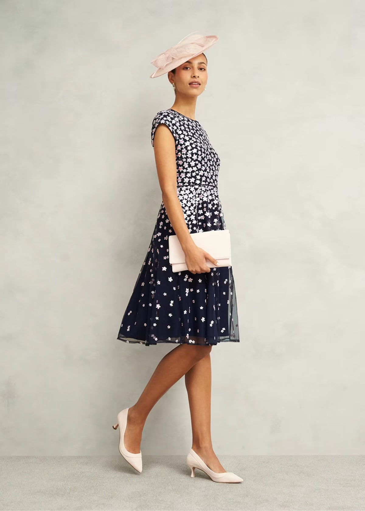 A collage of four images of models wearing floral occasion dresses from Hobbs.