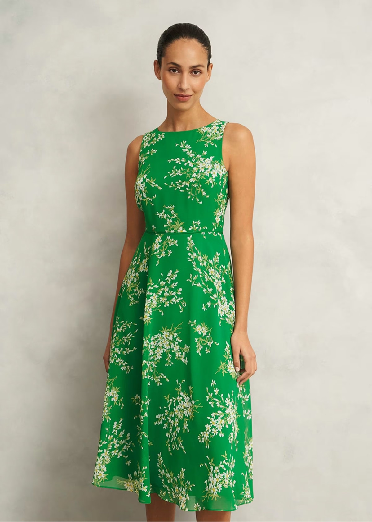 A collage of four images of models wearing floral occasion dresses from Hobbs.