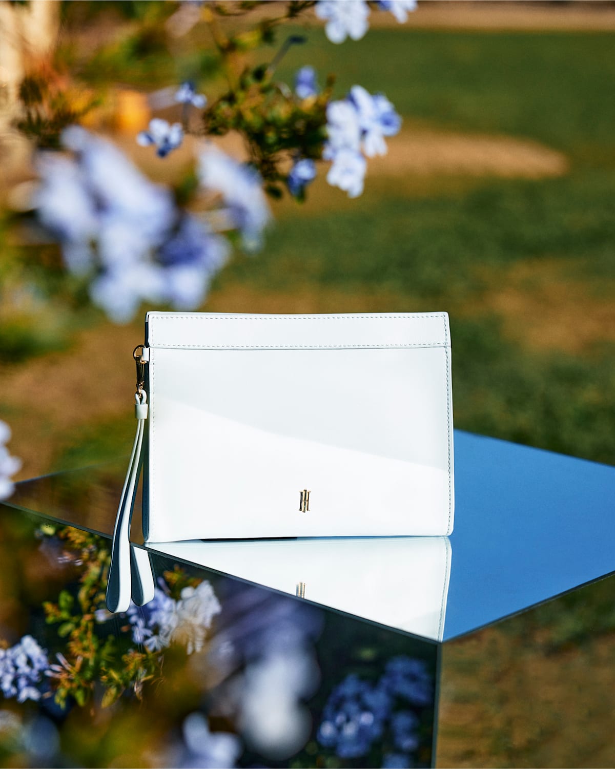 An image of a pale blue clutch bag by Hobbs.