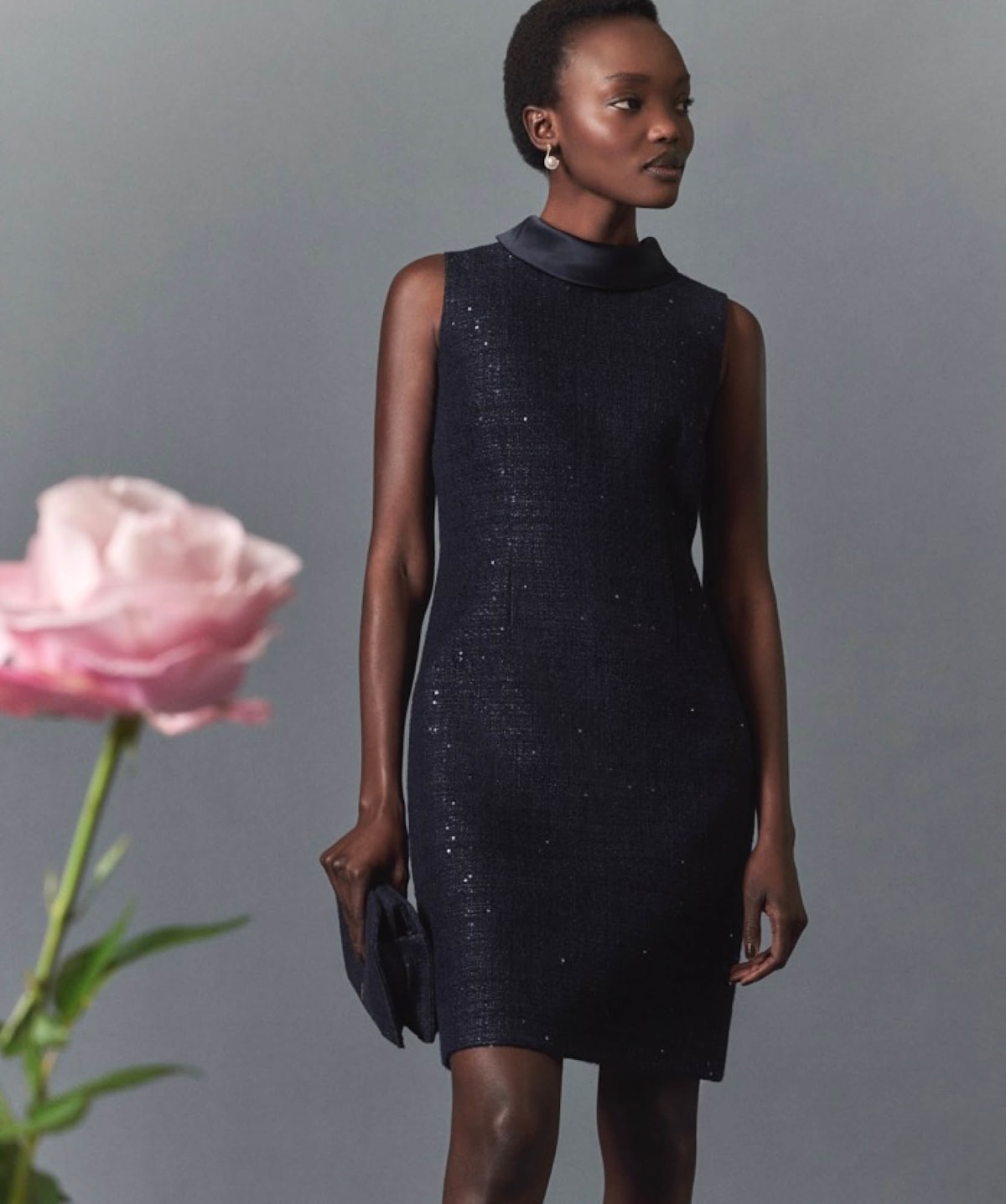 A gallery of images showing a model wearing a matching occasion dress and jacket.