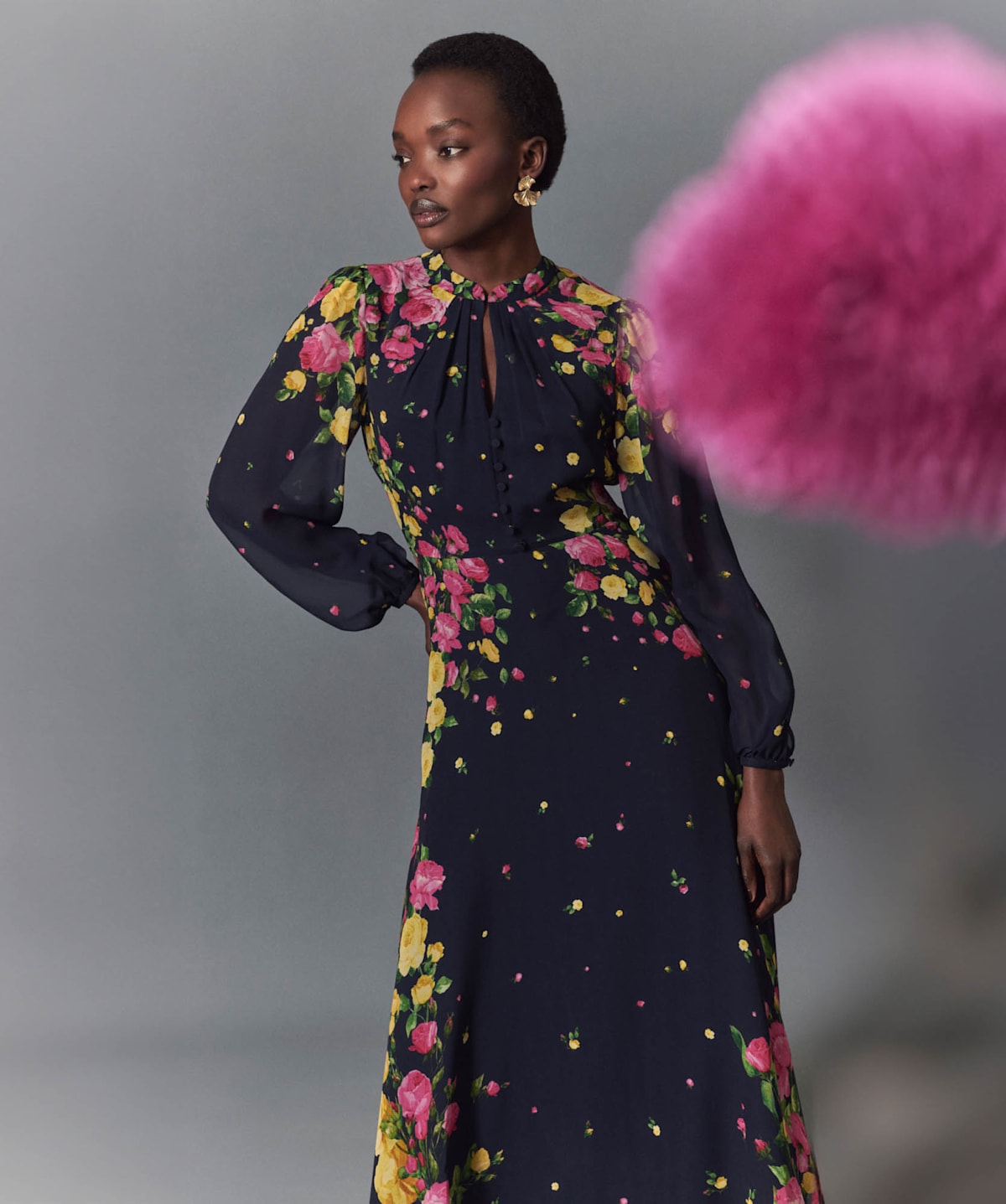 Image of model wearing a long sleeve floral midi dress and close-up of print.