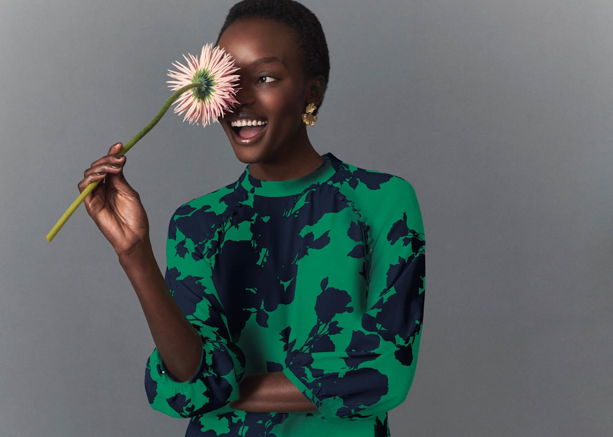 Image of a model wearing a floral occasion dress.